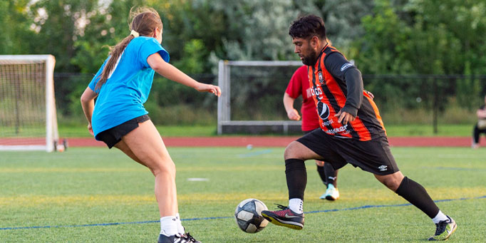 Sunday coed indoor soccer league in Mississauga at Applewood with players competing during a match
