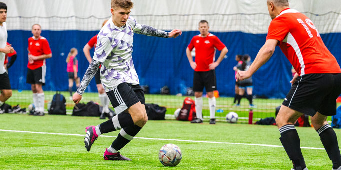 Wednesday men's indoor soccer league in Mississauga at Applewood and Lakeshore Collegiate with active gameplay on the field